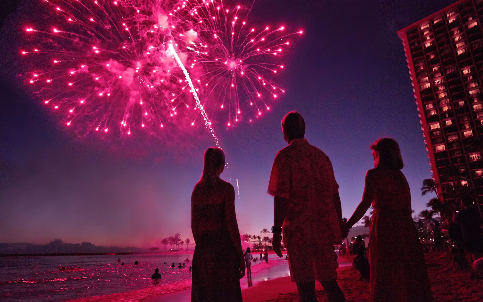 a photo of fireworks from the beach