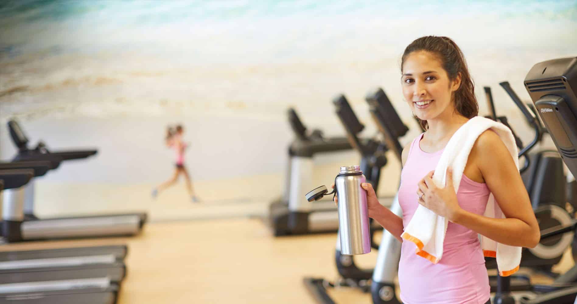 A woman using fitness equipment at the Fitness Center