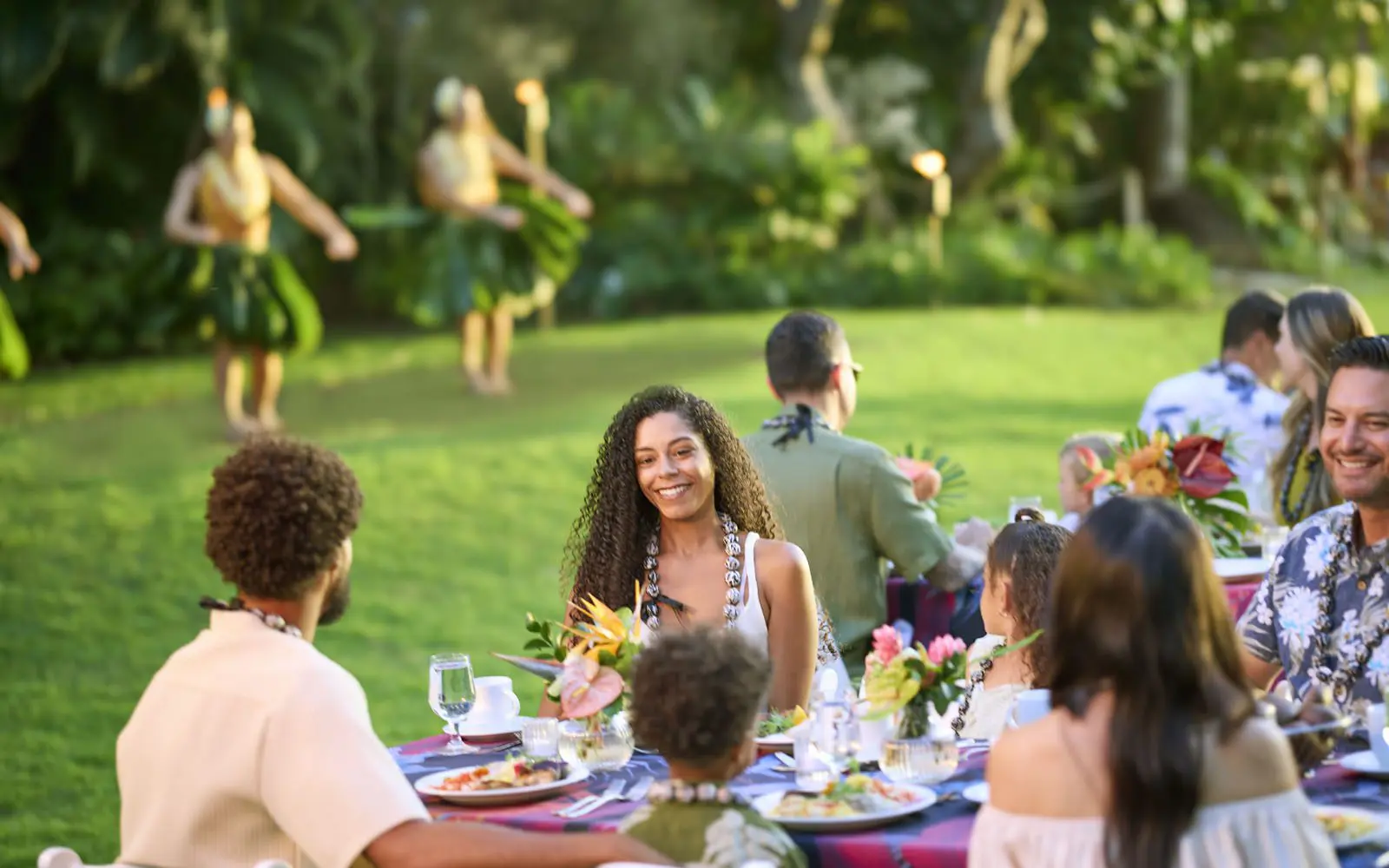 Smiling people at the Waikiki Starlight Luau