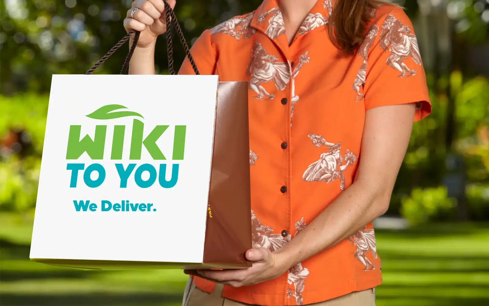 A woman holding a bag that says Wiki to You
