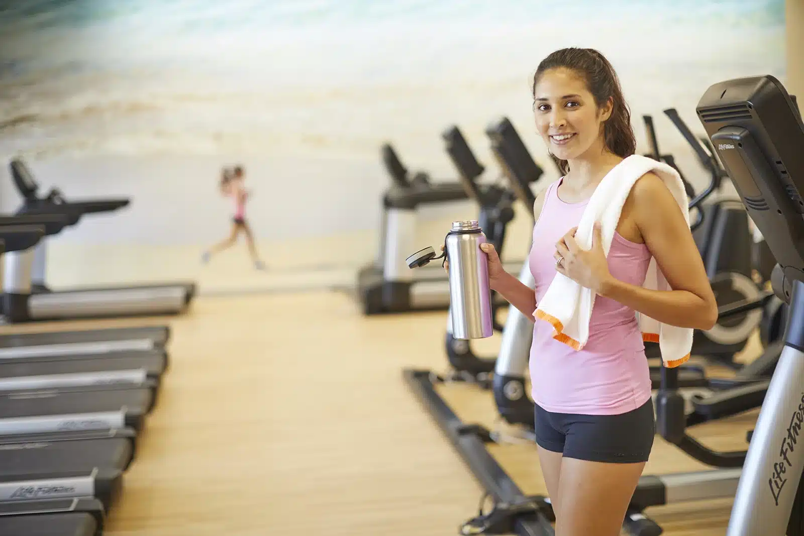 A woman working out at the Mandara Fitness Center in the Kalia Tower