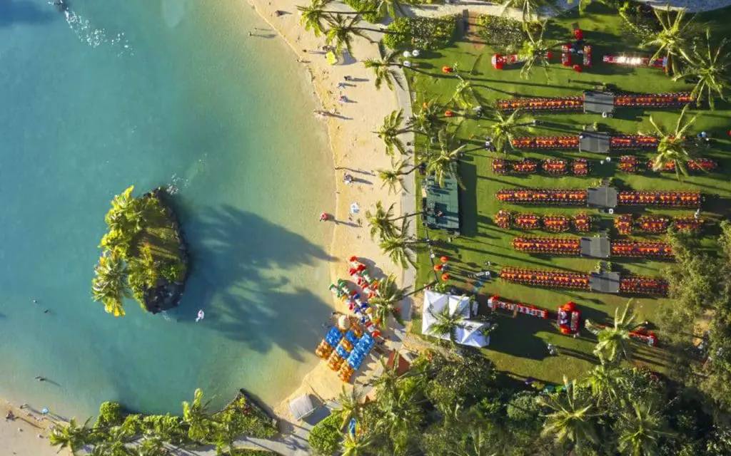 Aerial image of The Great Lawn showing tables set up for a large event in front of the lagoon.