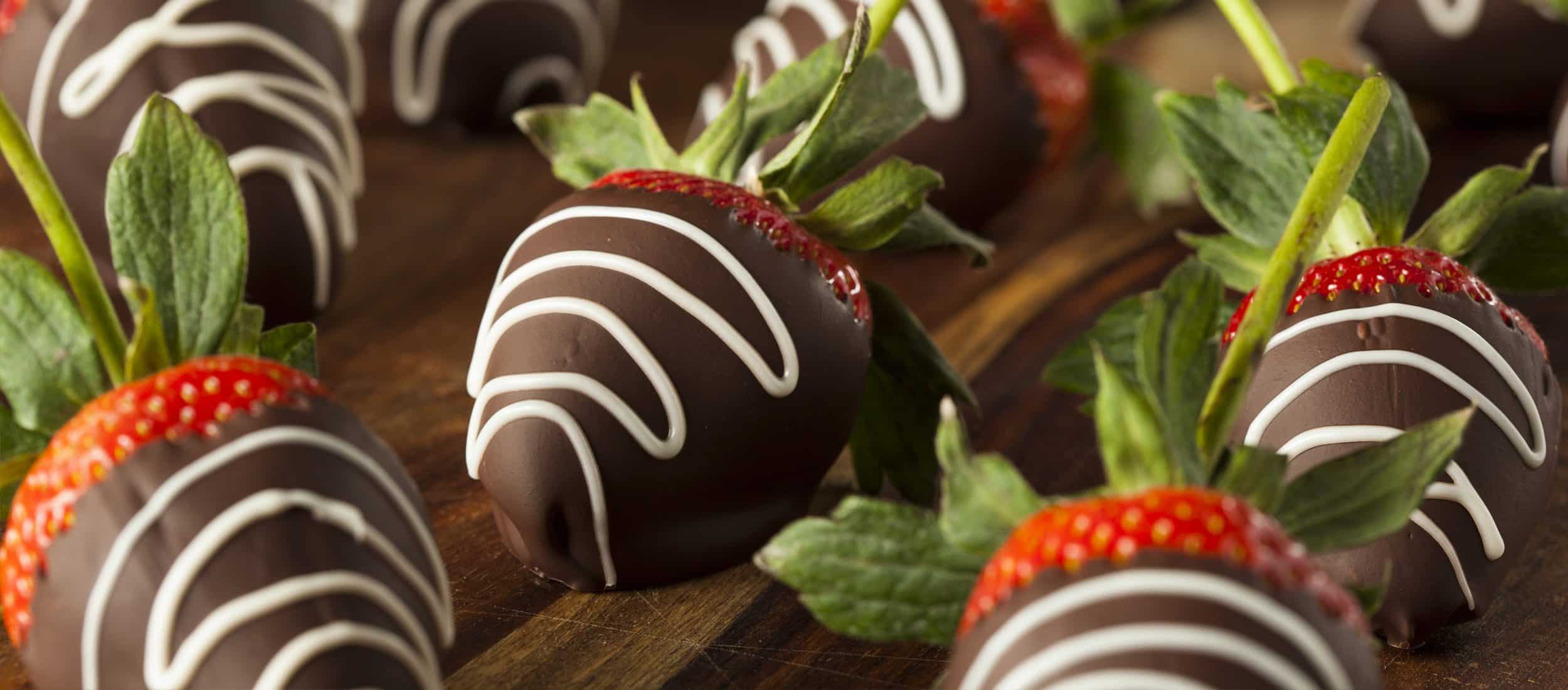 Chocolate covered strawberries with brown chocolate and white chocolate scribbled line on the top