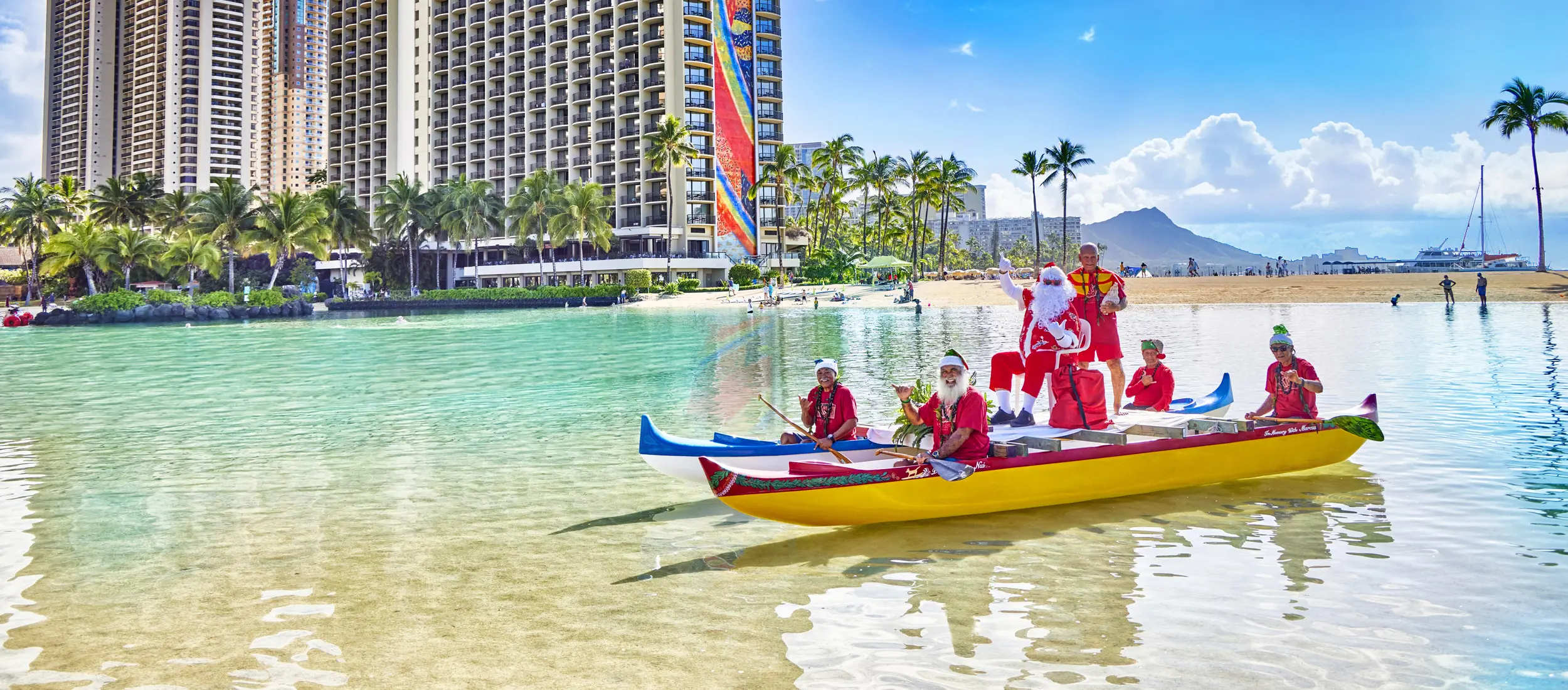 Hawaiian Santa on a canoe in the lagoon