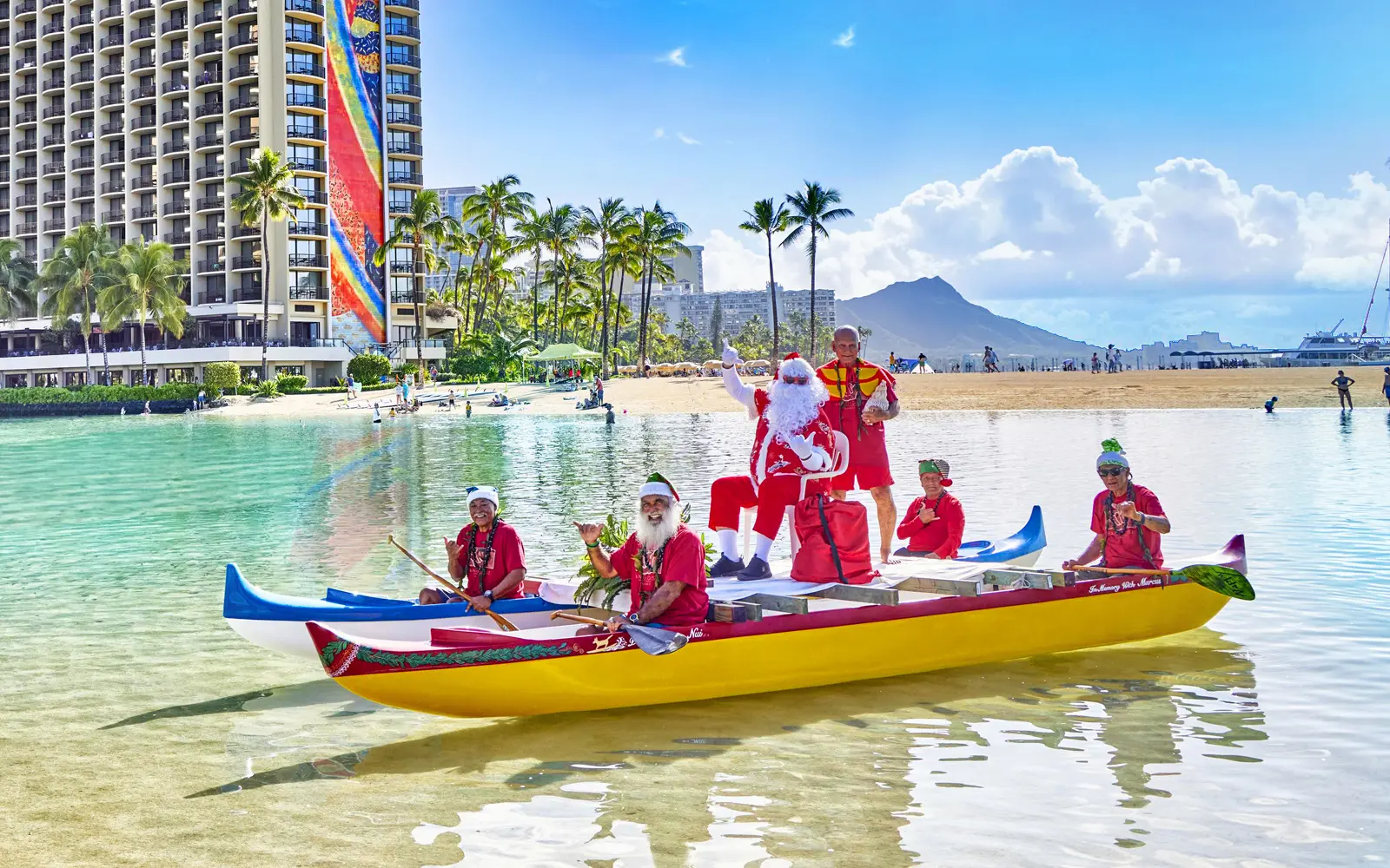 Hawaiian santa on a canoe in the lagoon