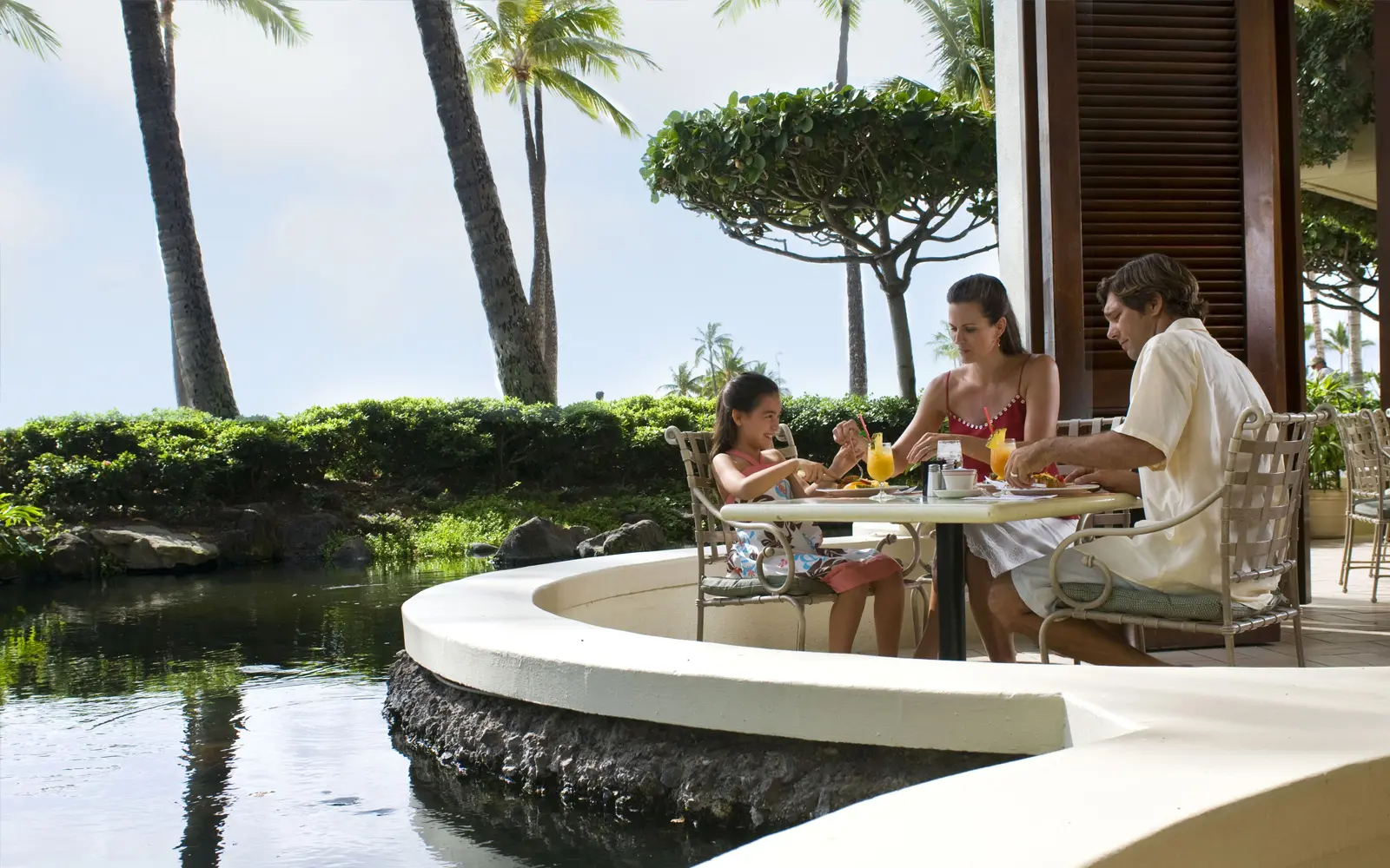 A family enjoying breakfast at the Rainbow Lanai at the Hilton Hawaiian Village