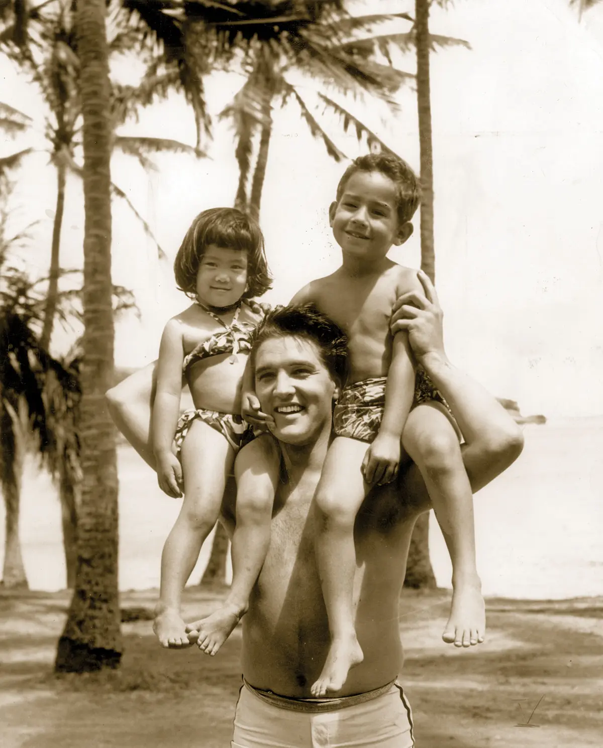 Elvis with two fans in Waikiki Beach